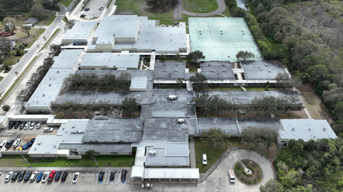 Tampa Florida, Aerial view of Progress Village Middle School campus, showing a mix of old and new roofing.
